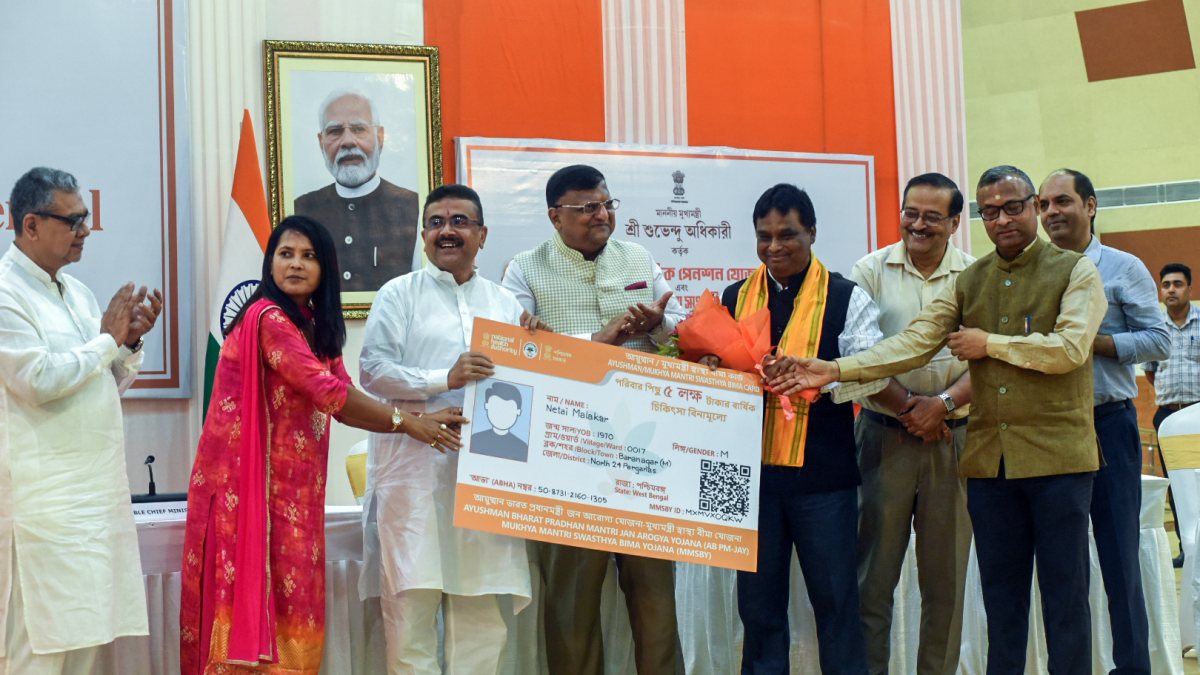 West Bengal CM hands over health insurance card to beneficiary in Howrah