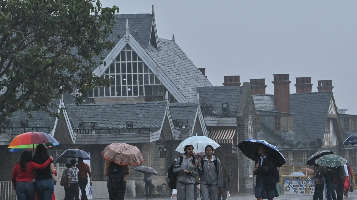 Heavy rain lashes Shimla, locals brave downpour with umbrellas