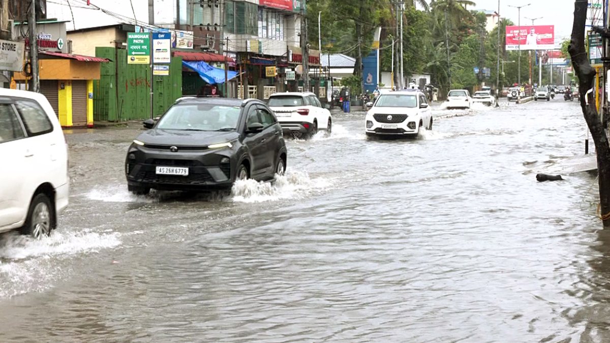Guwahati commuters wade through waterlogged streets after heavy rain