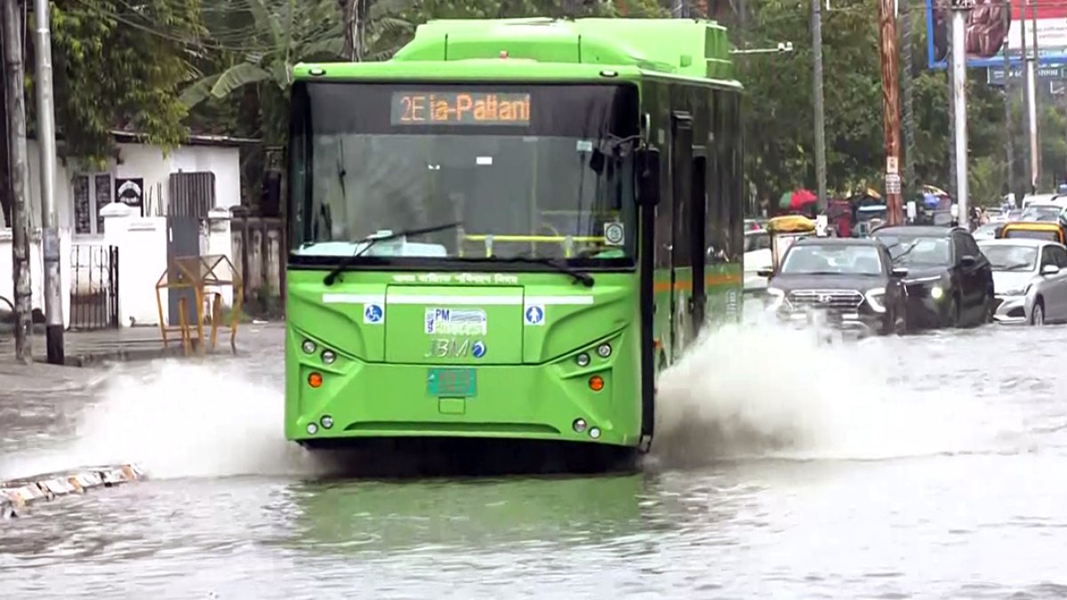 Guwahati commuters wade through waterlogged street after heavy rain