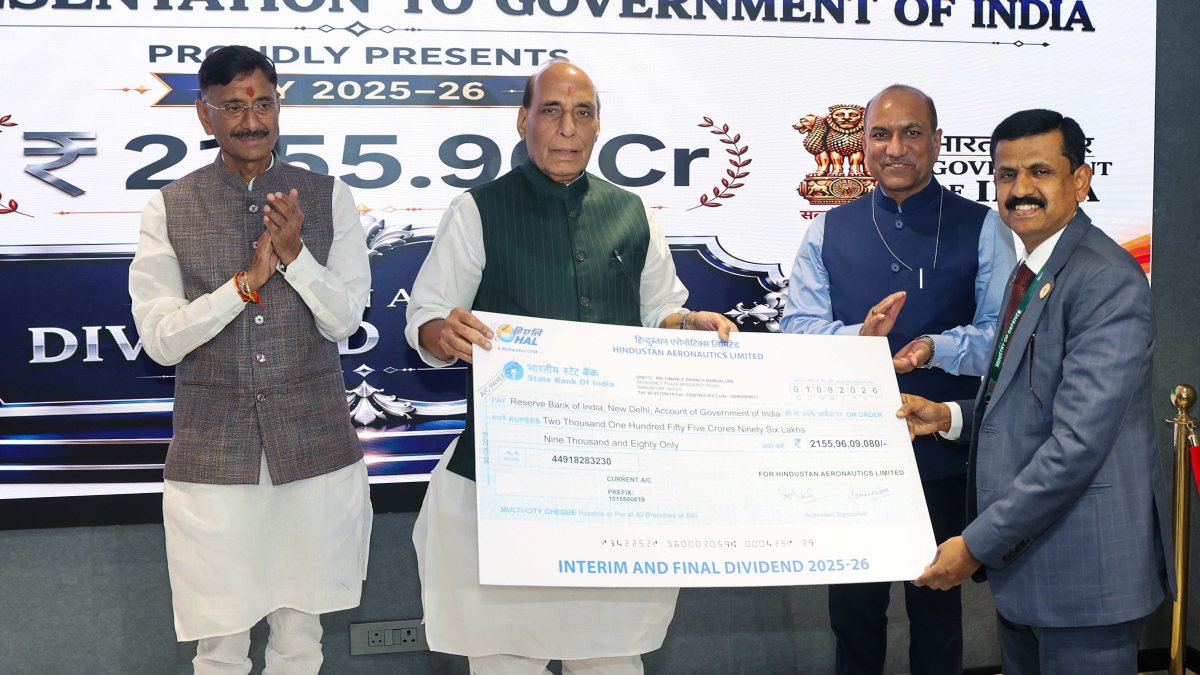 Rajnath Singh hands cheque to HAL chief at DPSU review