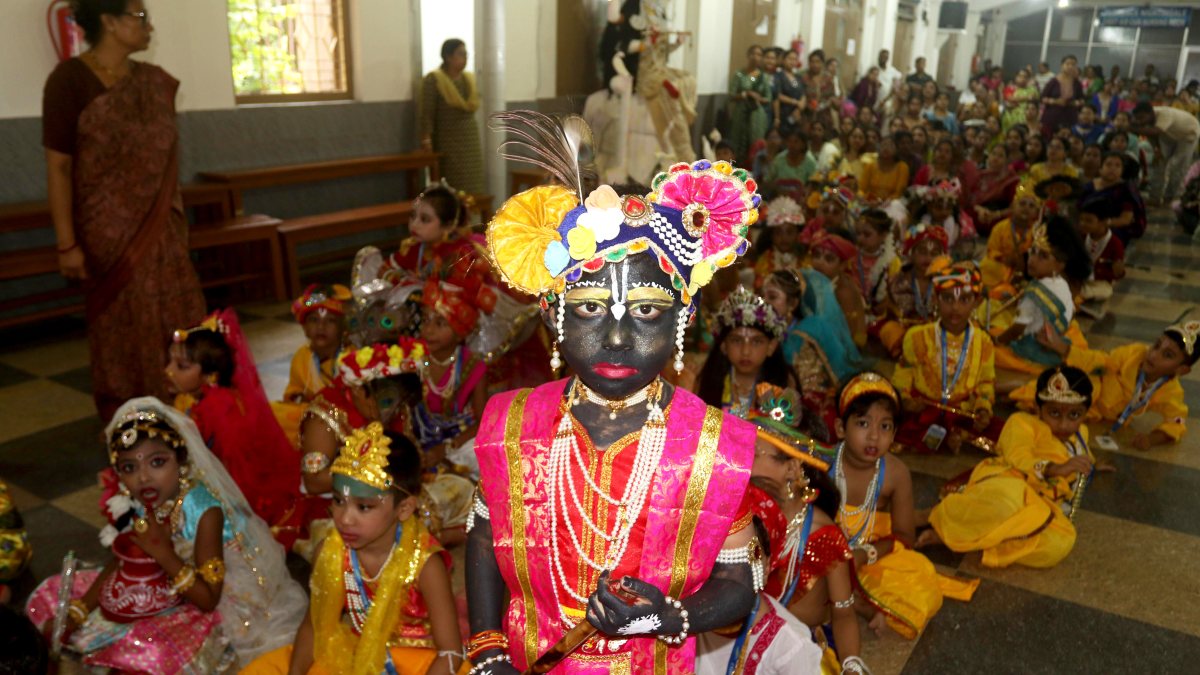Schoolchildren in Krishna costumes rehearse for Janmashtami in Agartala