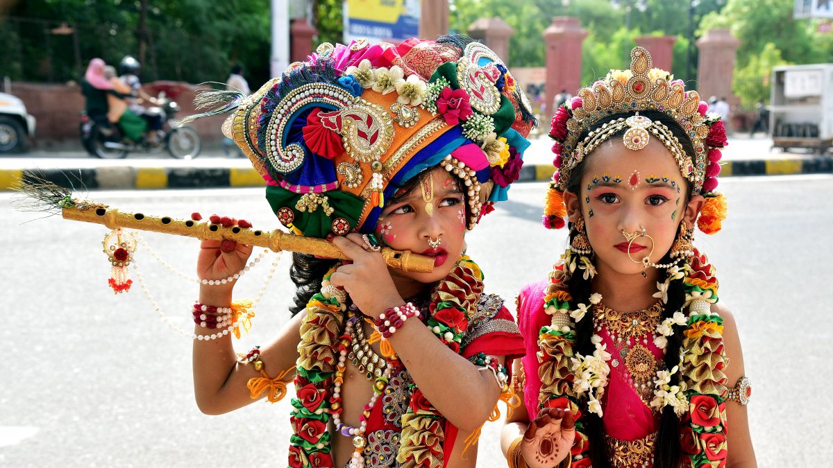 Children in Krishna-Radha costumes pose ahead of Janmashtami