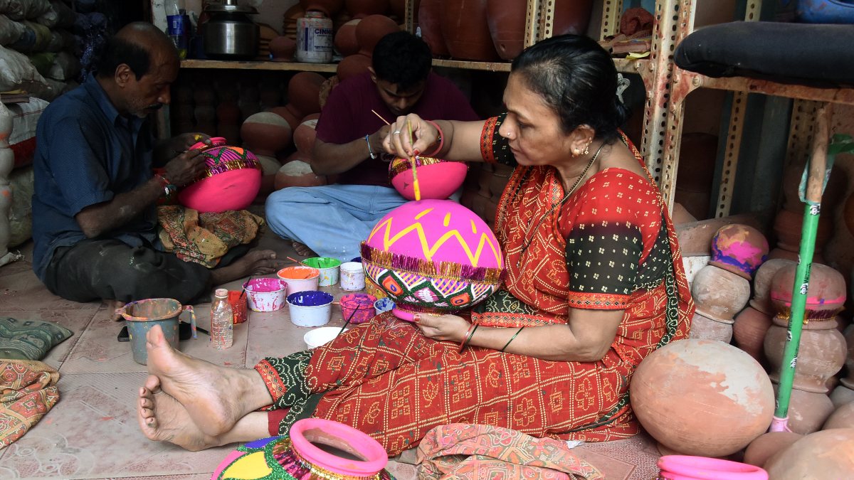 Artists paint earthen pots ahead of Dahi Handi festival in Mumbai
