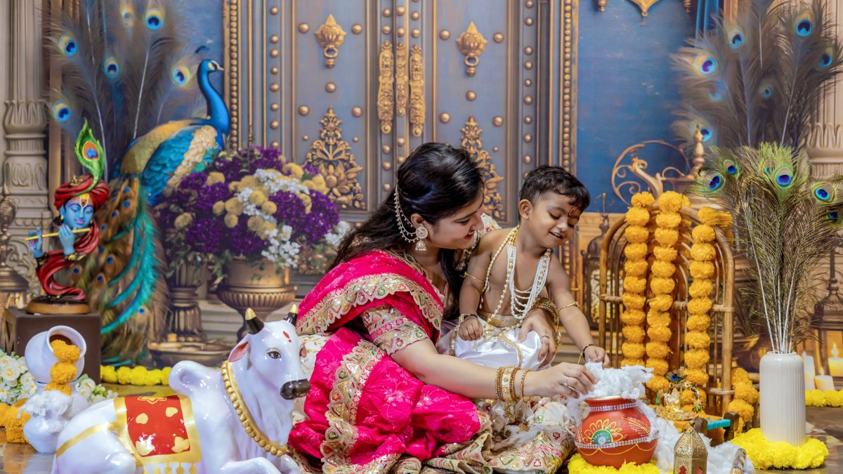Mother and child dressed as Yashoda and Krishna ahead of Janmashtami