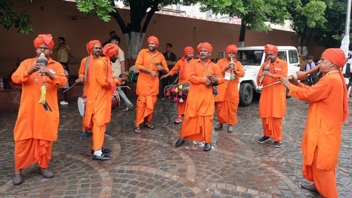 Artists play pungi at Janmashtami procession in Mathura
