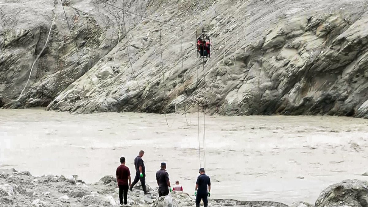 Nepal residents use makeshift zip line after flash flood