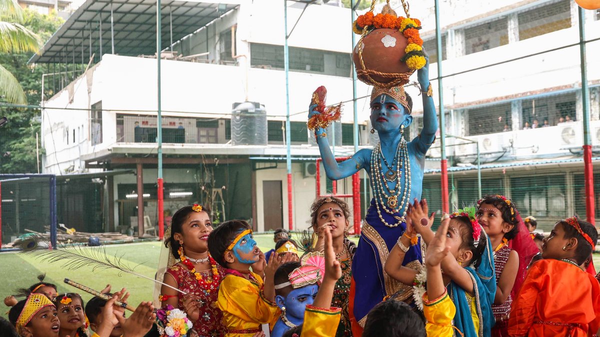 Child in Krishna costume breaks Dahi Handi in Mumbai