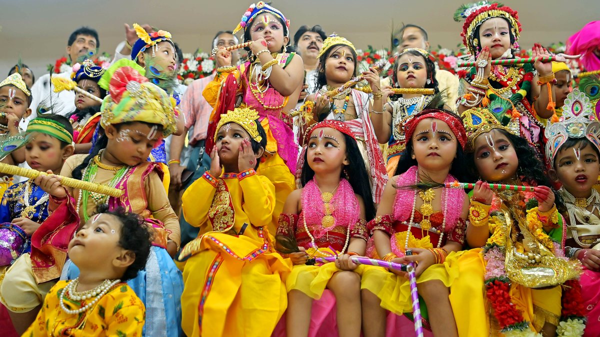 Kids in Krishna costumes at Agartala Janmashtami event
