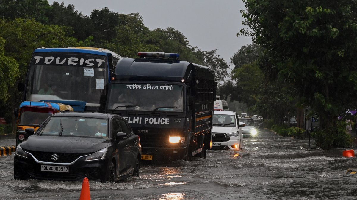 Heavy rain floods streets near Shivaji Stadium Metro Station