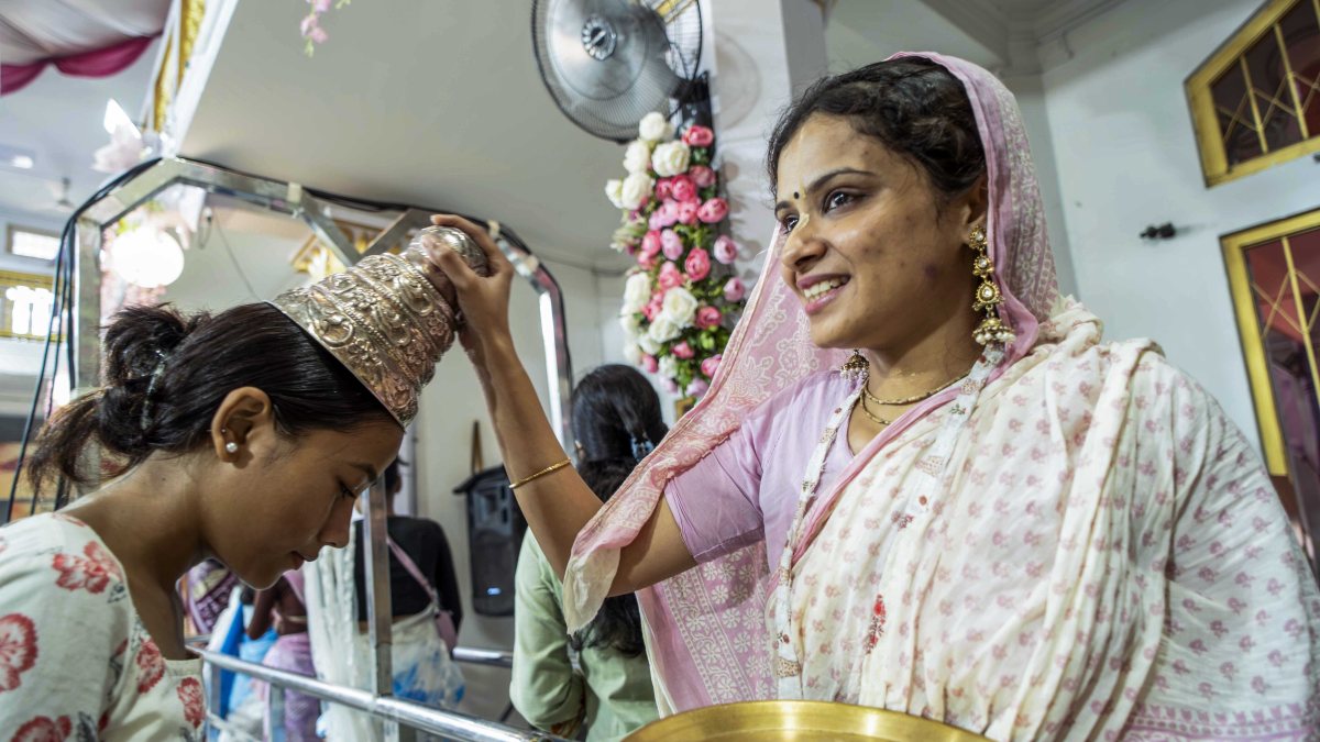 Woman priest blesses devotee at Guwahati Janmashtami celebrations