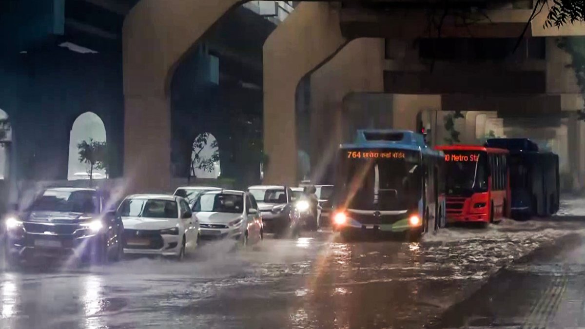 Delhi buses wade through waterlogged roads after heavy rain