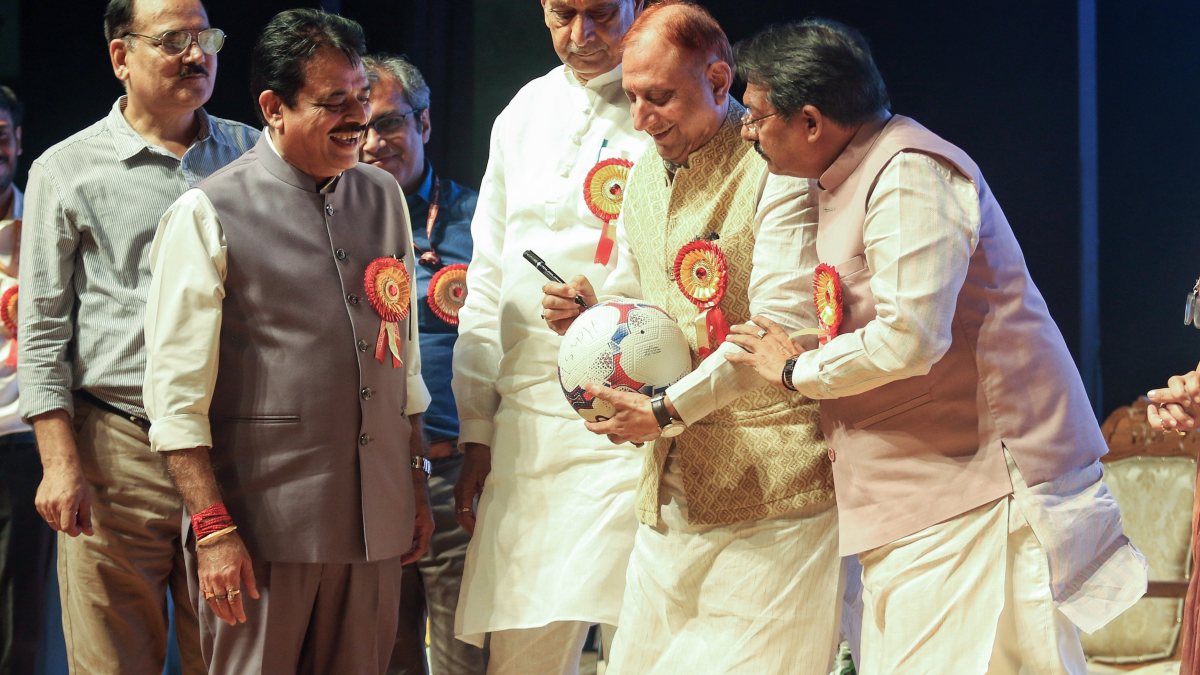 Delhi Mayor autographs football at MCD Teacher's Day event