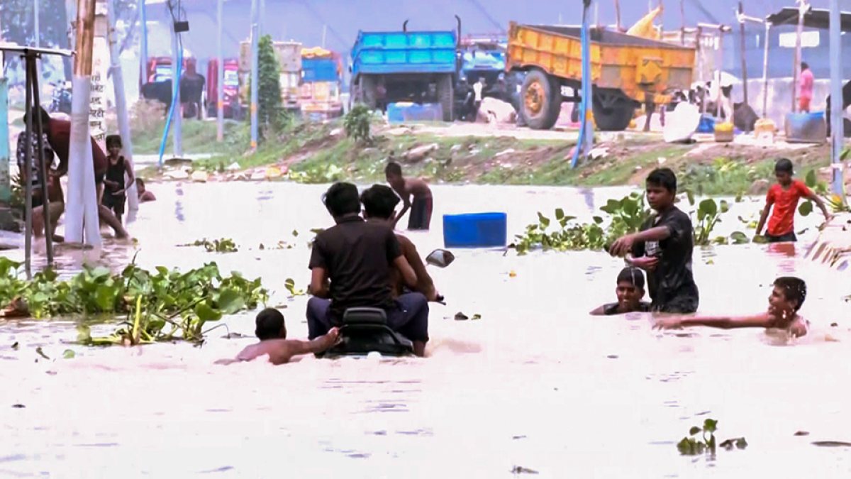 Bihar floods: Patna residents wade through submerged Kangan Ghat area