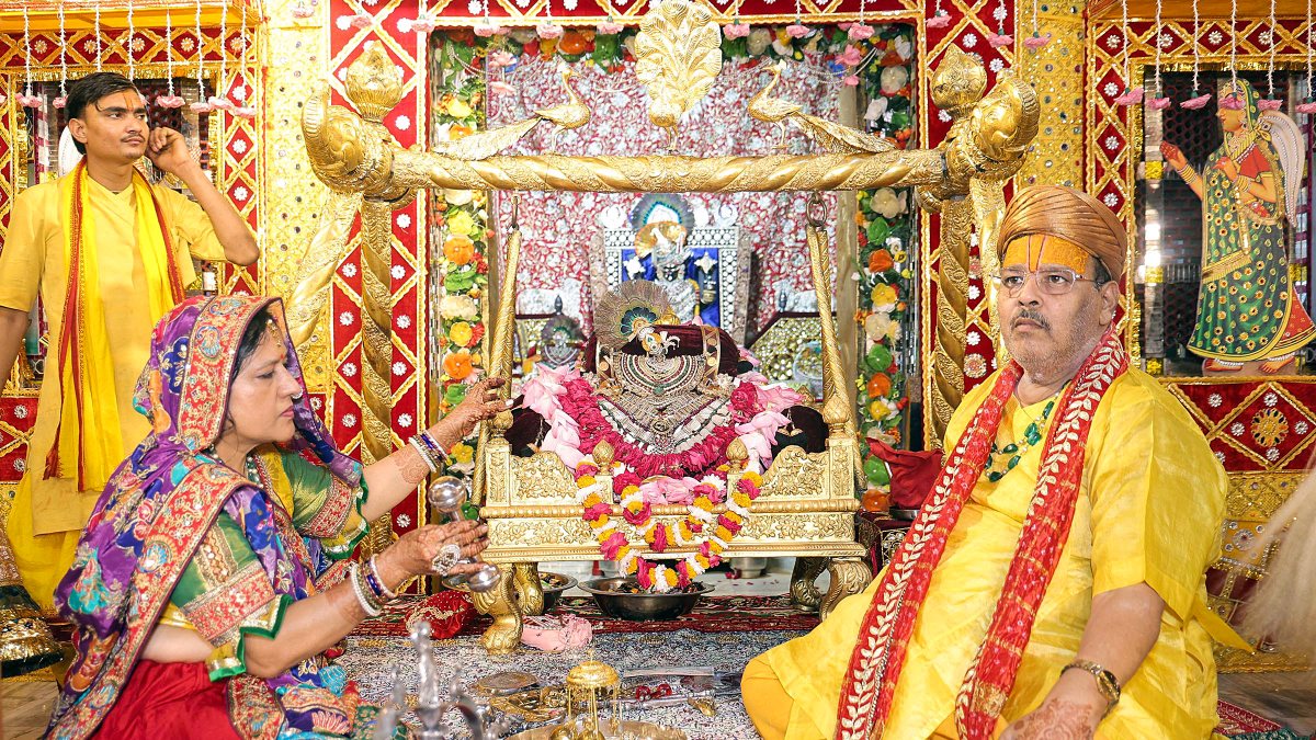 Devotees swing Radha-Krishna idols at Nandotsava in Mathura