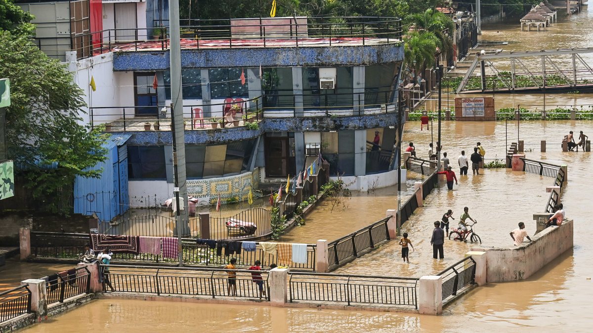 People enjoy floodwaters of Ganga at Patna ghat