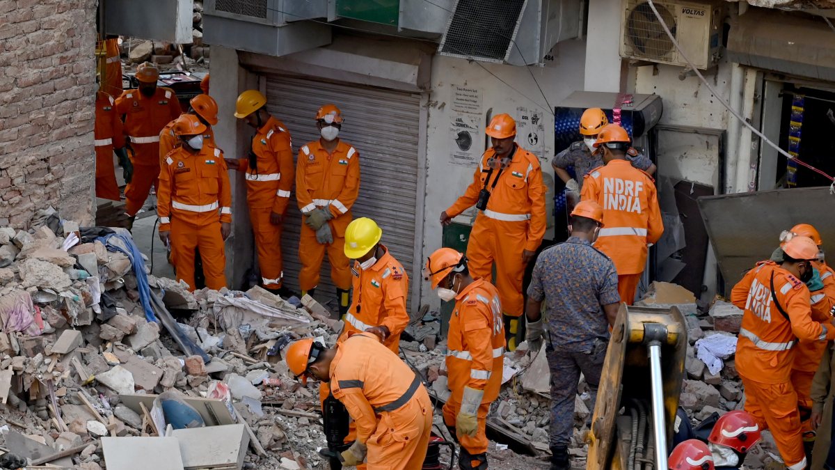 Rescuers search for survivors after building collapse in Delhi