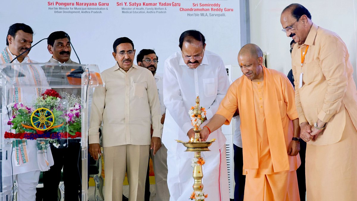Yogi, Venkaiah Naidu light lamp at Swarna Bharat Trust event