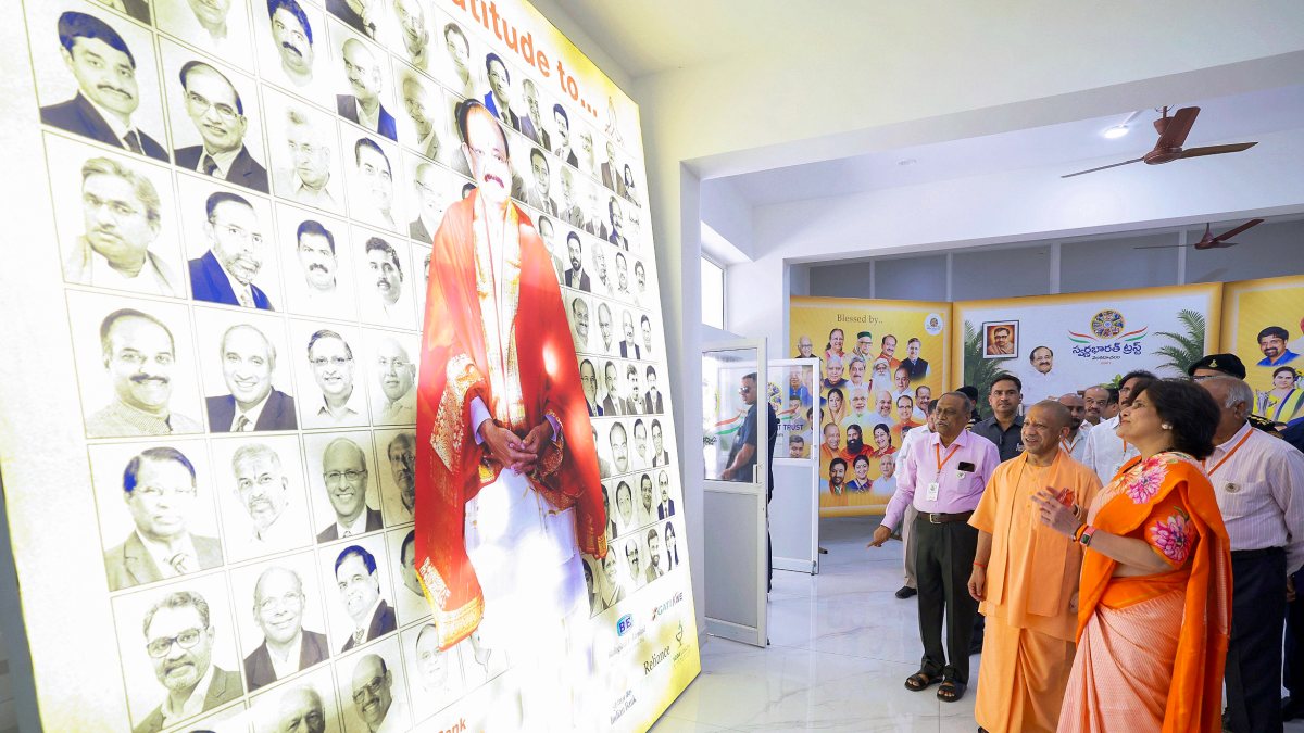 Yogi Adityanath views Venkaiah Naidu poster at trust event