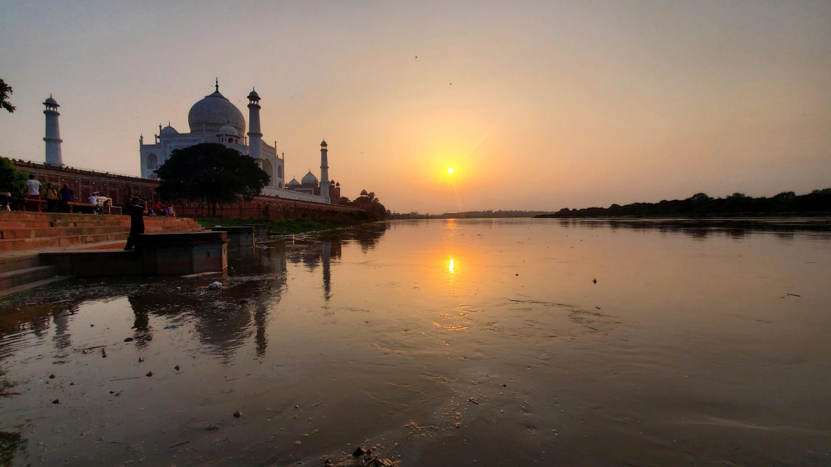 Sunset paints golden hues over Taj Mahal at Yamuna ghat