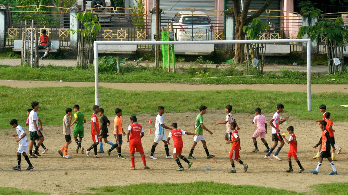 Boys practice football at Siliguri ground