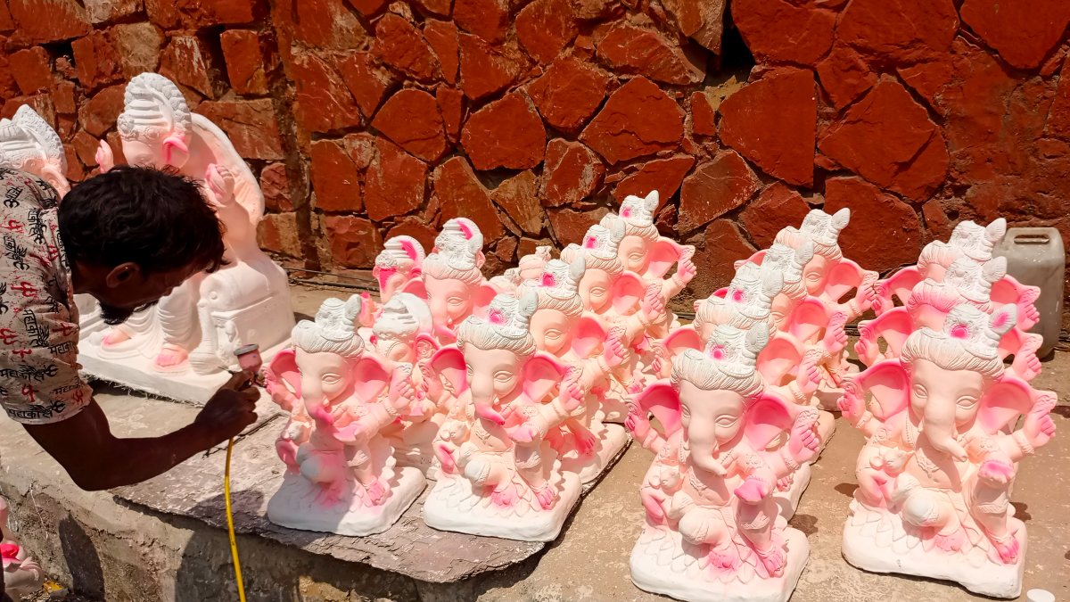 Artisan adds final touches to Ganesha idols in Jaipur