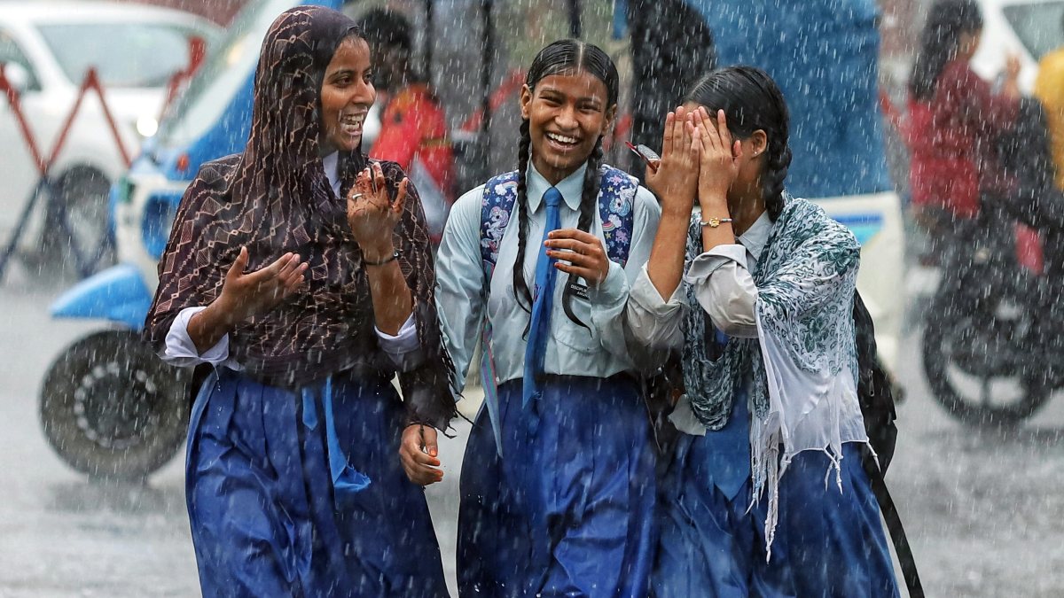 Students return from school amid heavy rain in Lucknow
