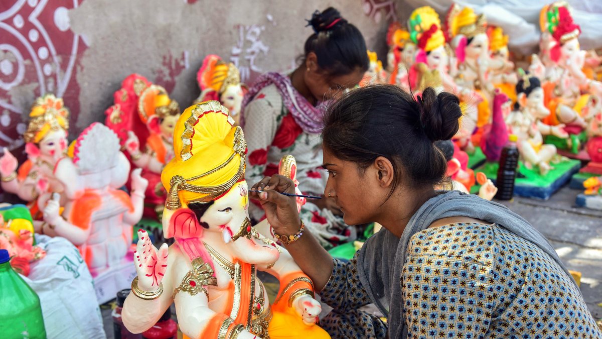 Artist gives final touches to Ganesh idol in Bikaner