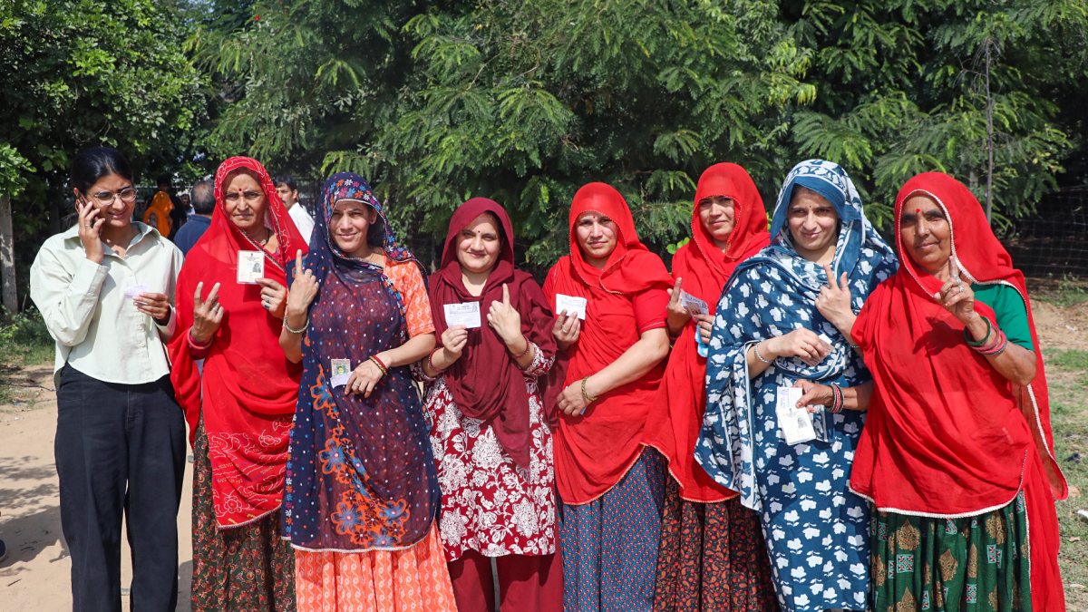 Voters pose for photo at Rajasthan civic polls polling station