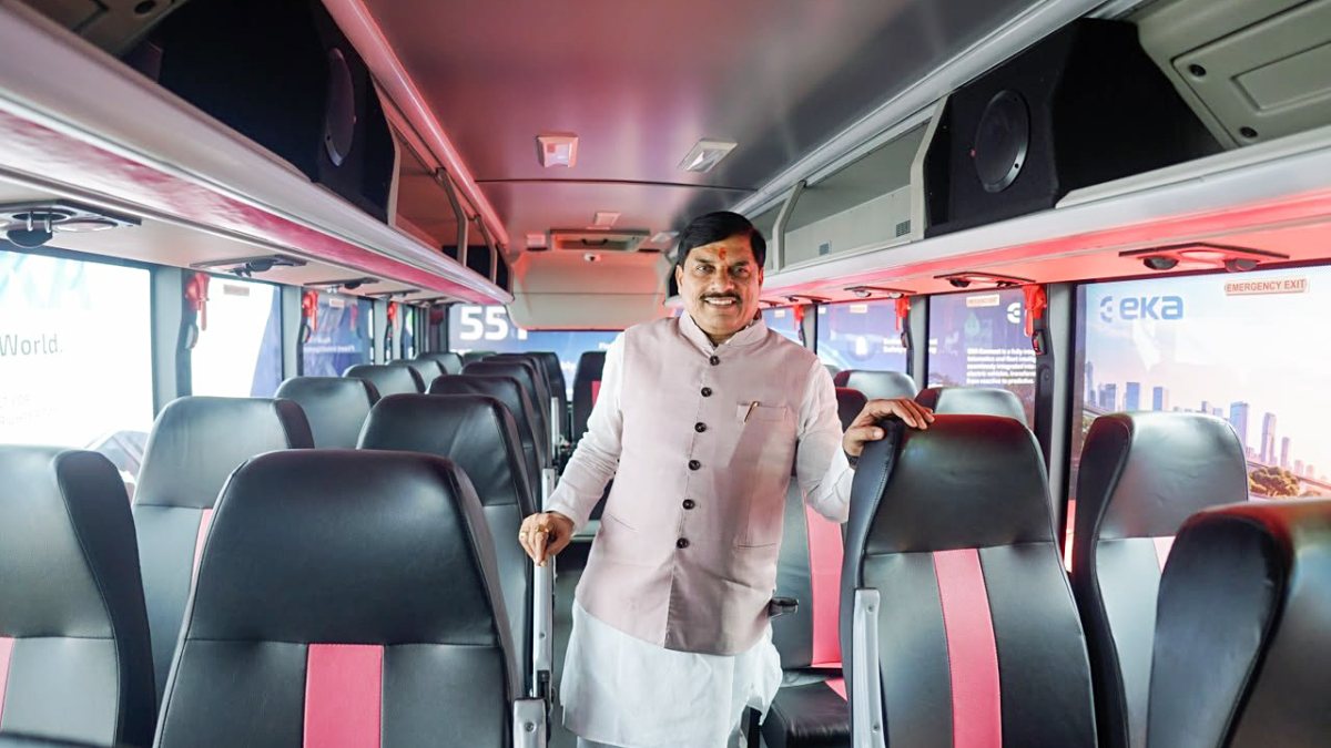 MP CM Mohan Yadav poses inside modern bus at Indore transport summit
