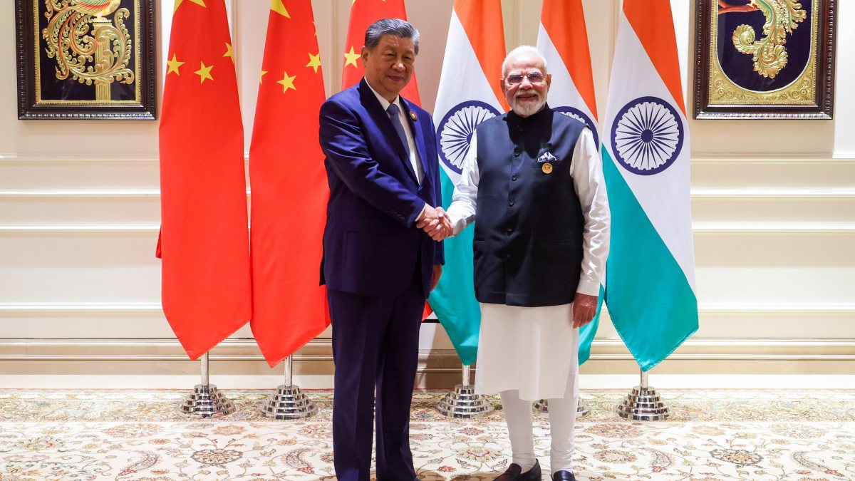 Modi and Xi shake hands at BRICS bilateral meeting