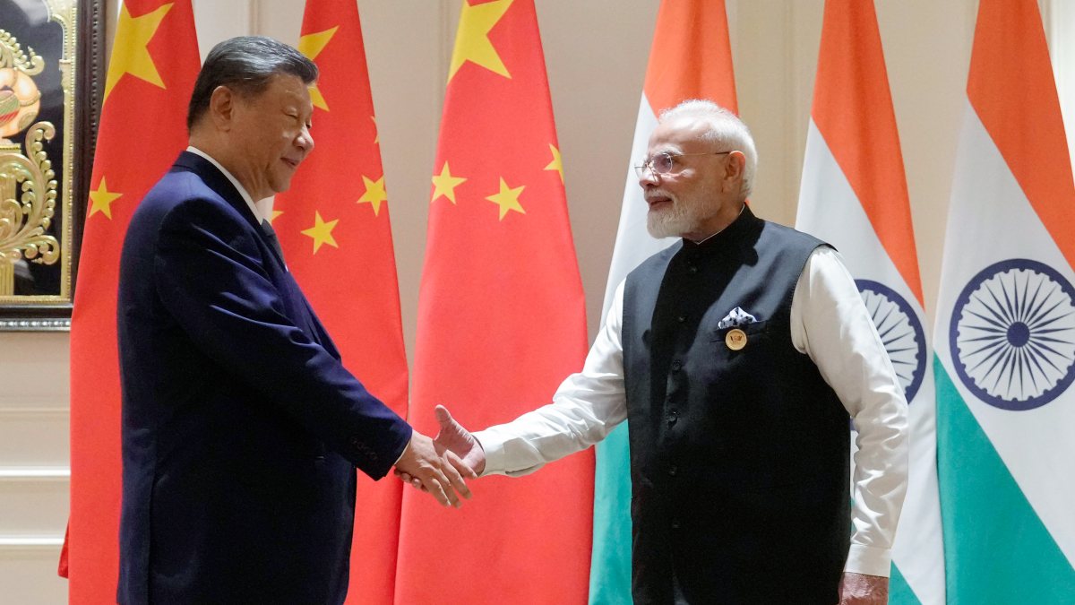 Modi and Xi shake hands at BRICS bilateral meeting