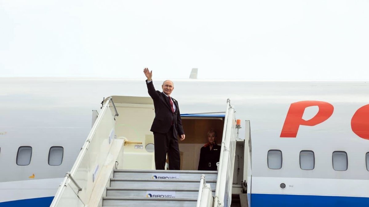 Putin waves at Delhi airport as he departs after BRICS Summit