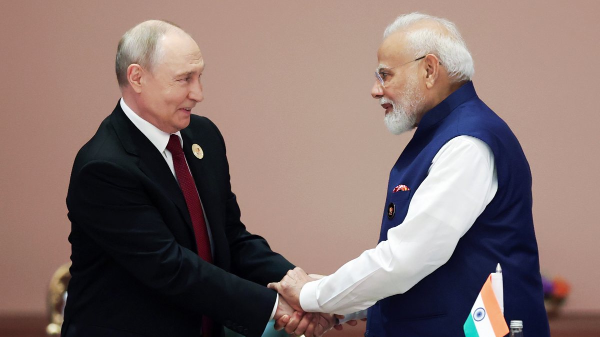 Modi and Putin shake hands at BRICS summit session