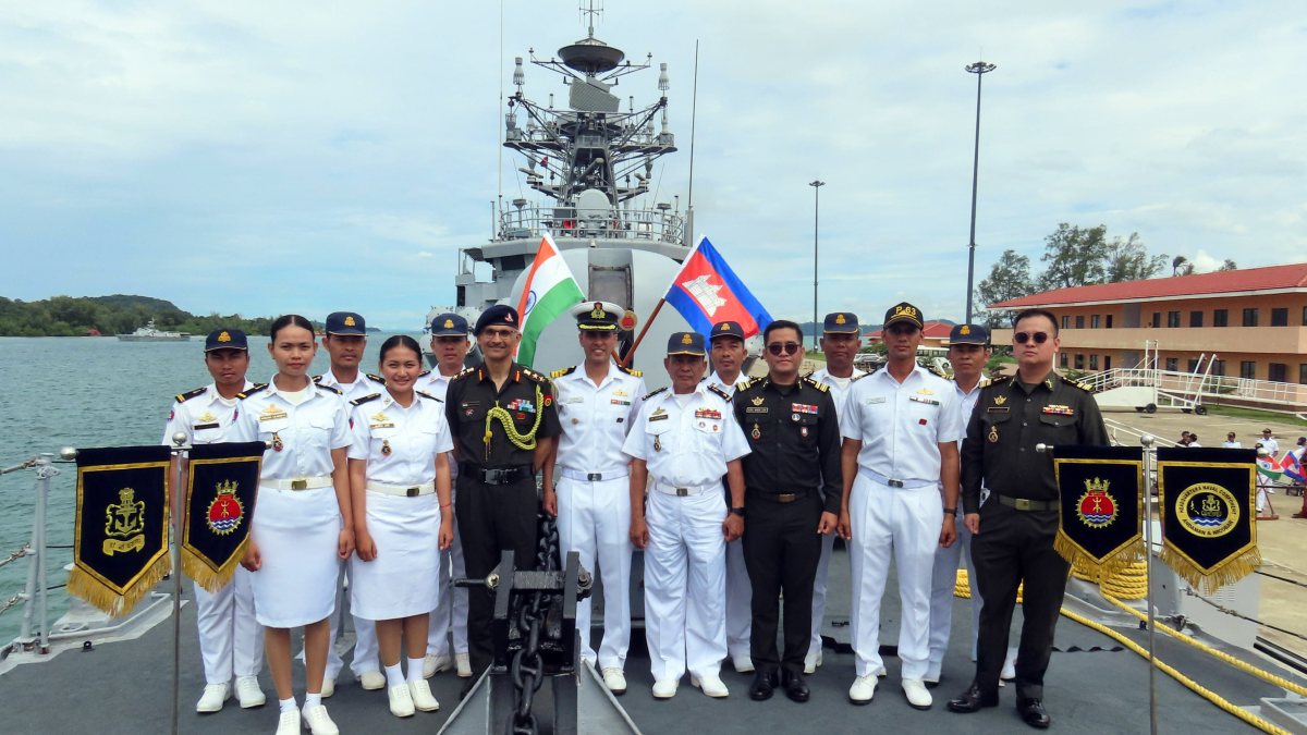 Indian and Cambodian naval officers pose on INS Kulish at Ream base