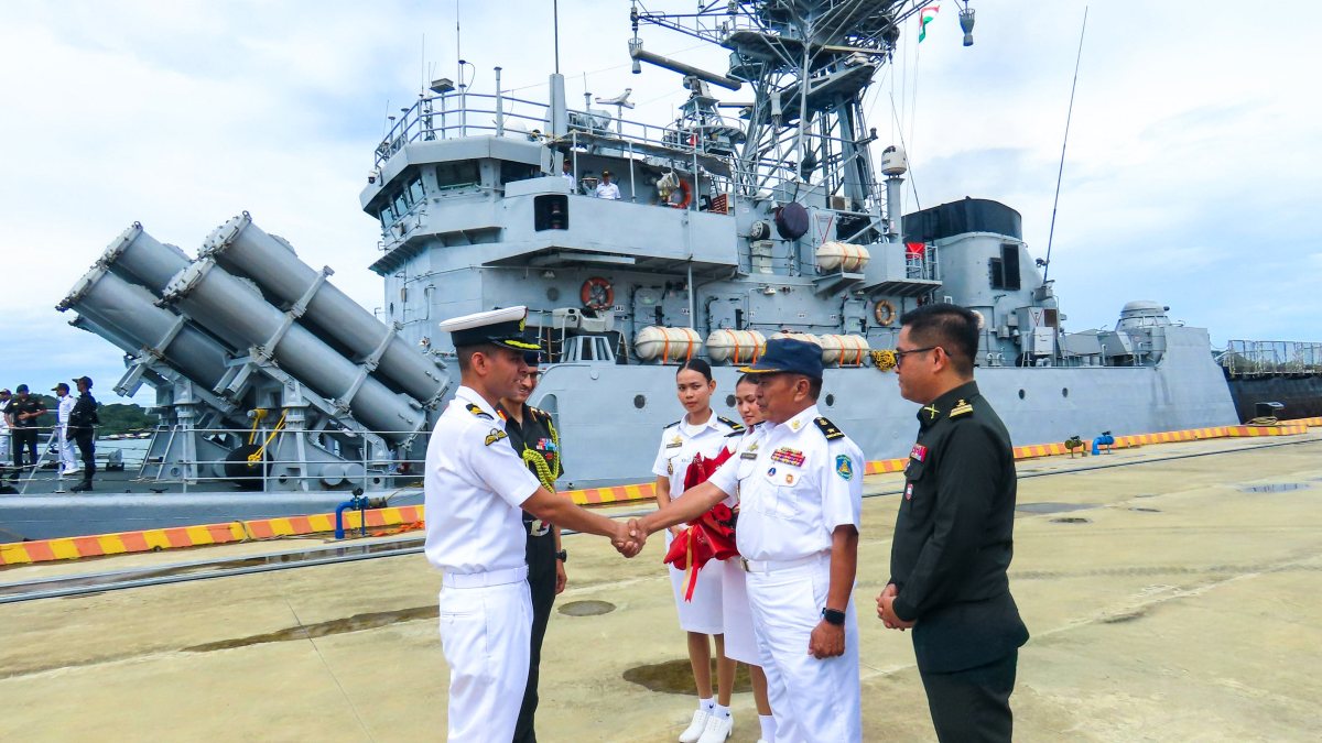 Indian Navy officer greets Cambodian official at Ream base