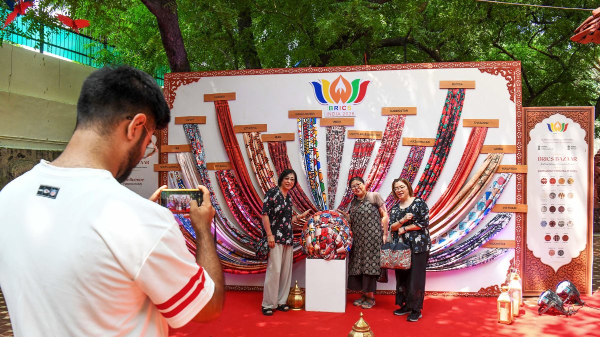 Visitors pose at BRICS Bazaar 2026 in New Delhi