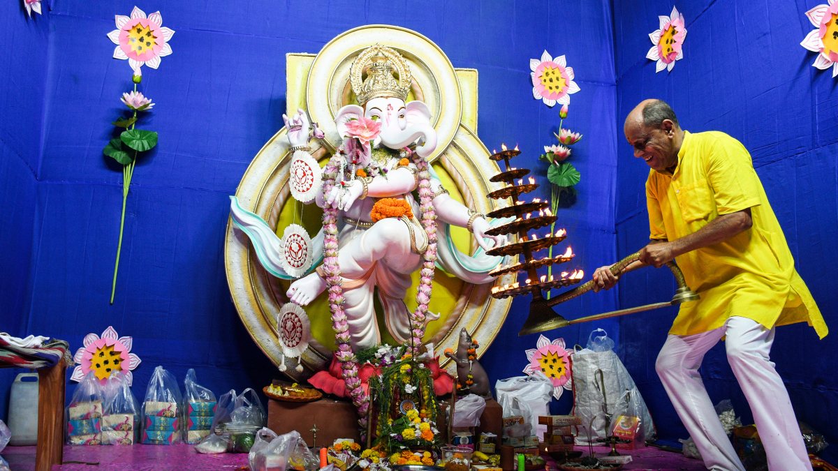 Devotee performs aarti for Ganesh Chaturthi in Kolkata