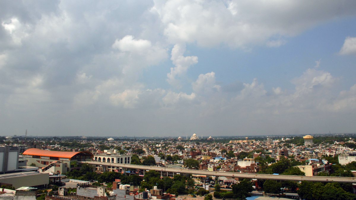 Cloudy sky over Taj Mahal seen from Agra metro track