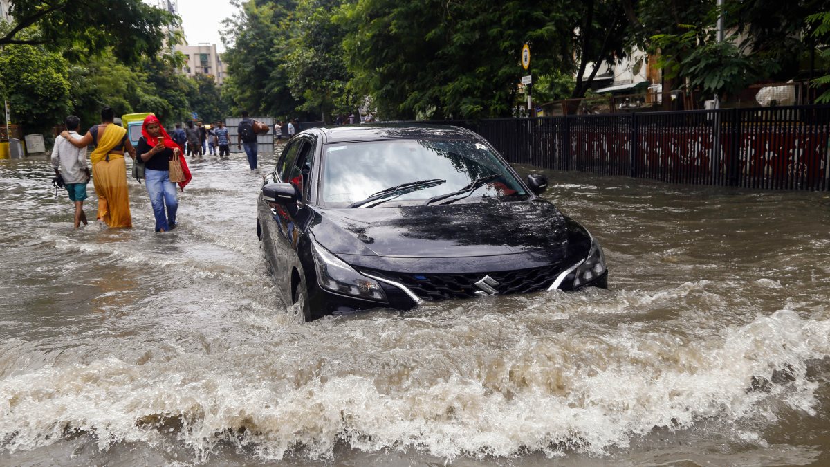 Ahmedabad residents wade through waterlogged streets after heavy rain