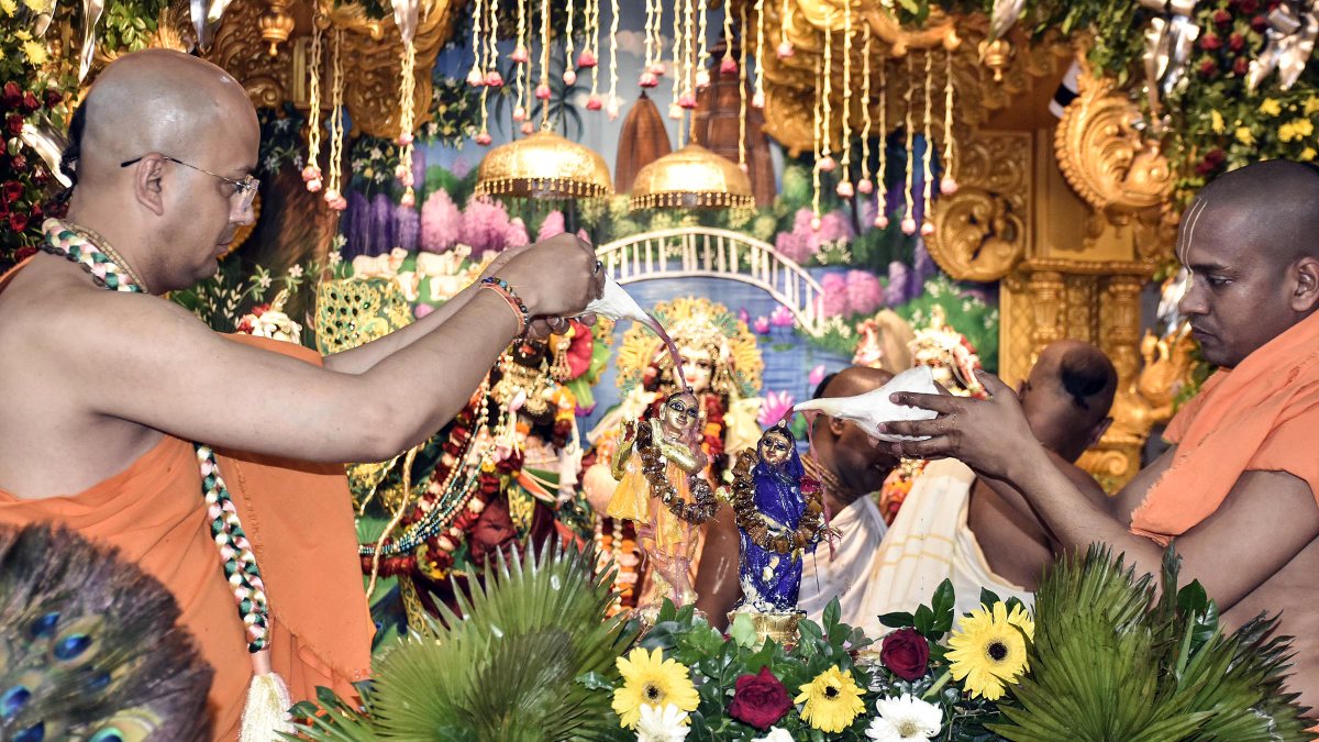 Priests perform Abhishek of Radha and Krishna at Patna ISKCON temple