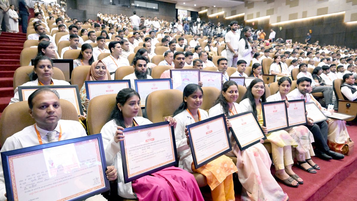 Selected candidates pose with appointment letters at Mission Rozgar event in Lucknow