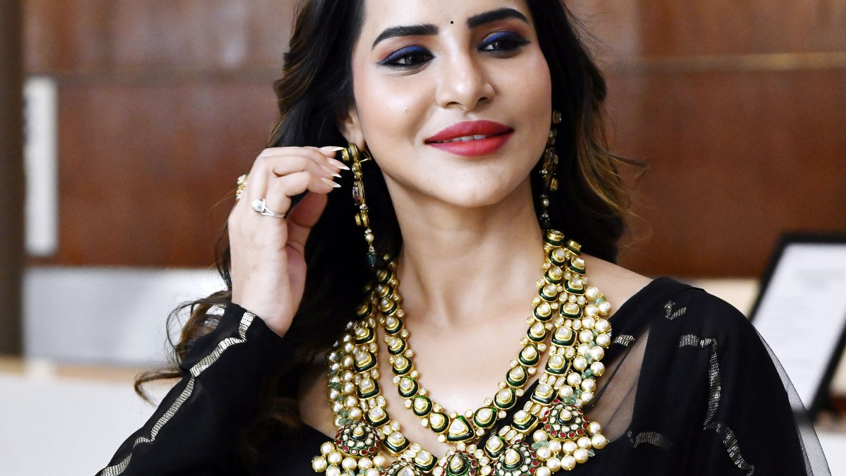 Actress Aashu Reddy poses at HiLife exhibition in Hyderabad