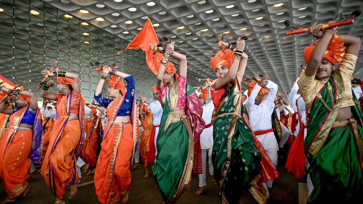 Artists perform Lezim dance at Mumbai airport Ganpati Palakhi