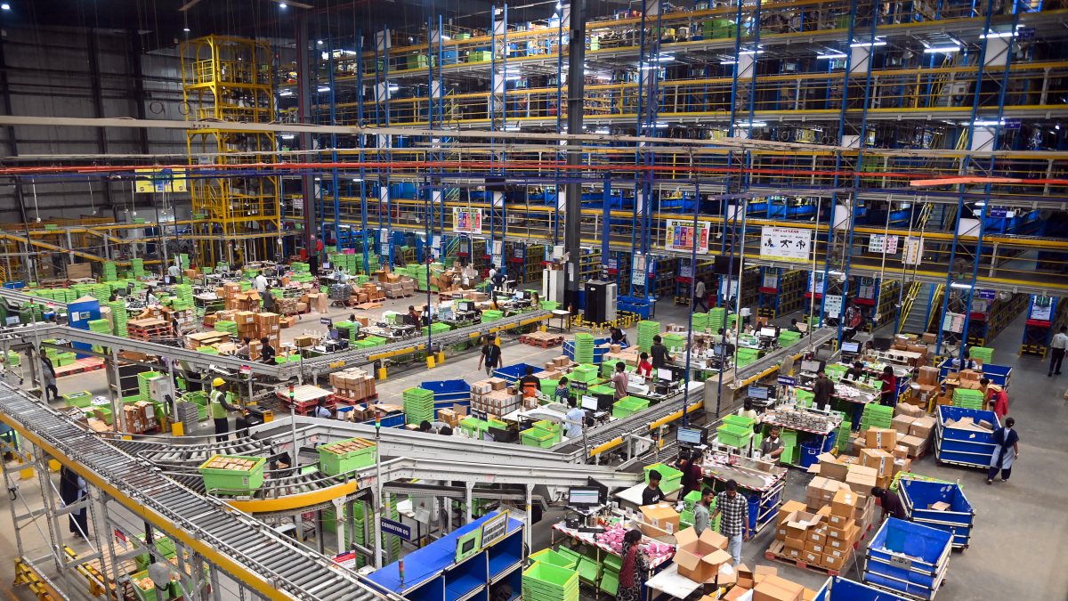Flipkart employees pack customer orders at Gurugram center