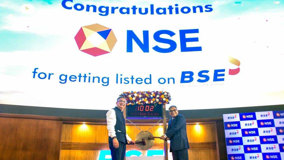 NSE and BSE chiefs pose at NSE listing ceremony in Mumbai