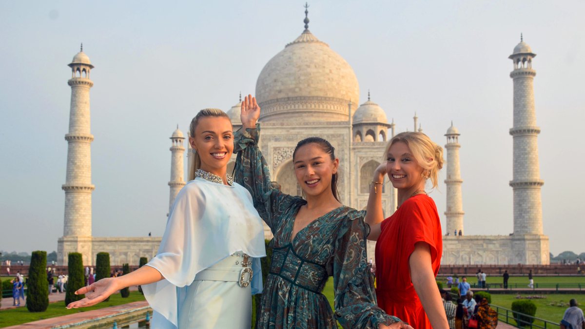 Miss Universe Great Britain poses with models at Taj Mahal