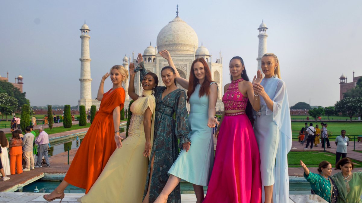 Miss Universe Great Britain poses with models at Taj Mahal