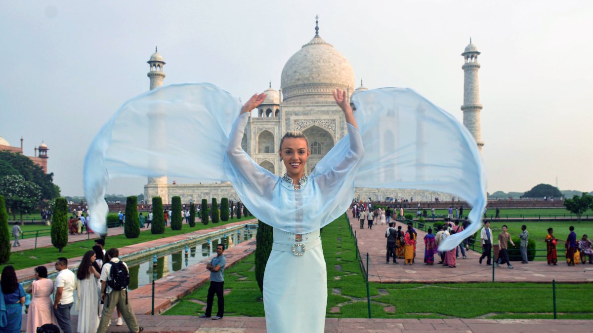 Model poses in front of Taj Mahal in Agra