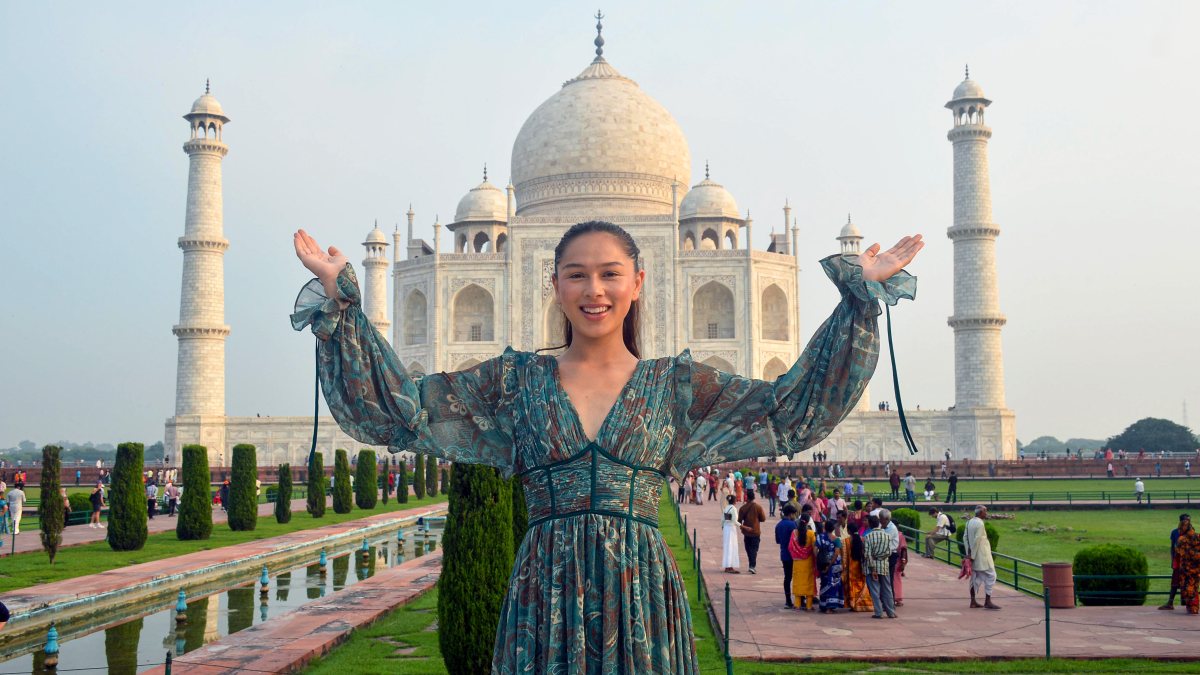 Miss Universe Great Britain poses before Taj Mahal
